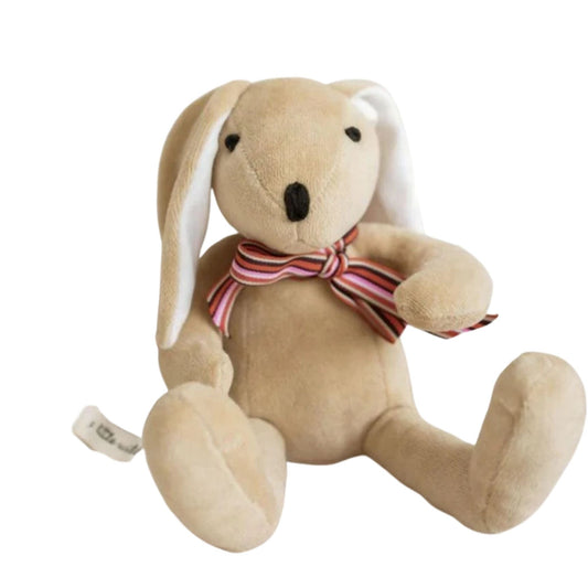 A beige plush toy in the shape of a bunny with white ears and a striped bow tie around its neck.